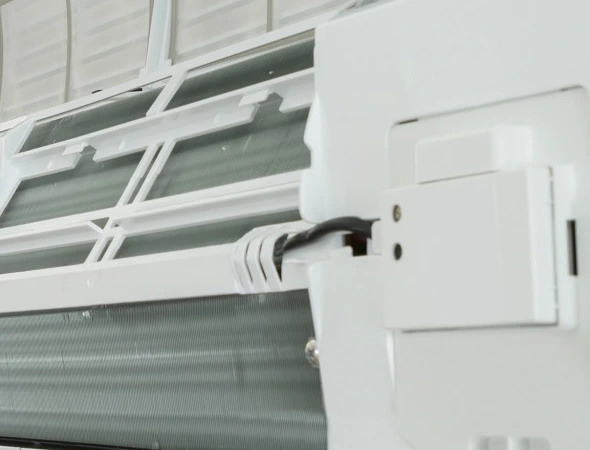 AC unit cooling a room, representing professional cooling system repair service for home comfort and efficiency.